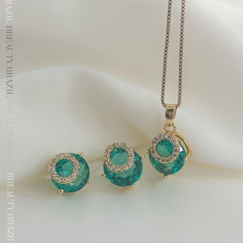 Brinco esmeralda com circulo cravejado