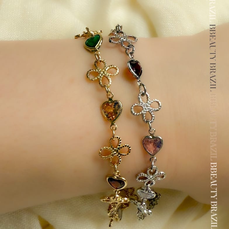 Pulseira flor vazada e cristais coloridos em ouro
